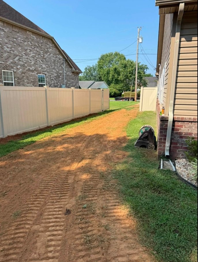 Bare soil before sod installation